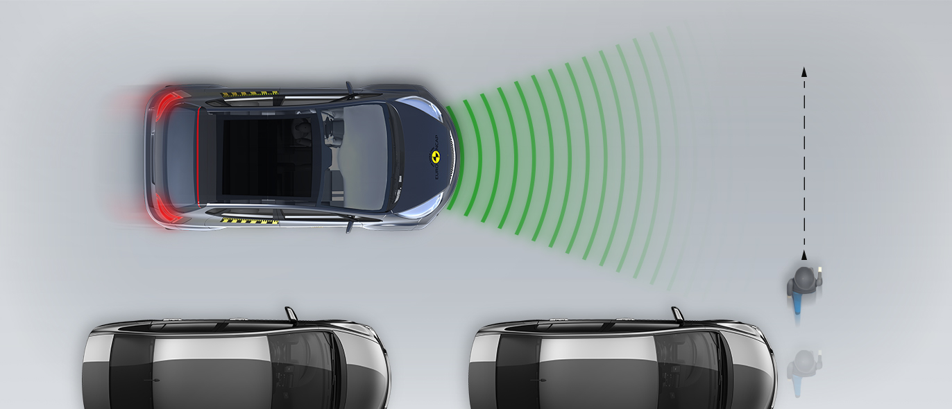 Child running from behind parked vehicles