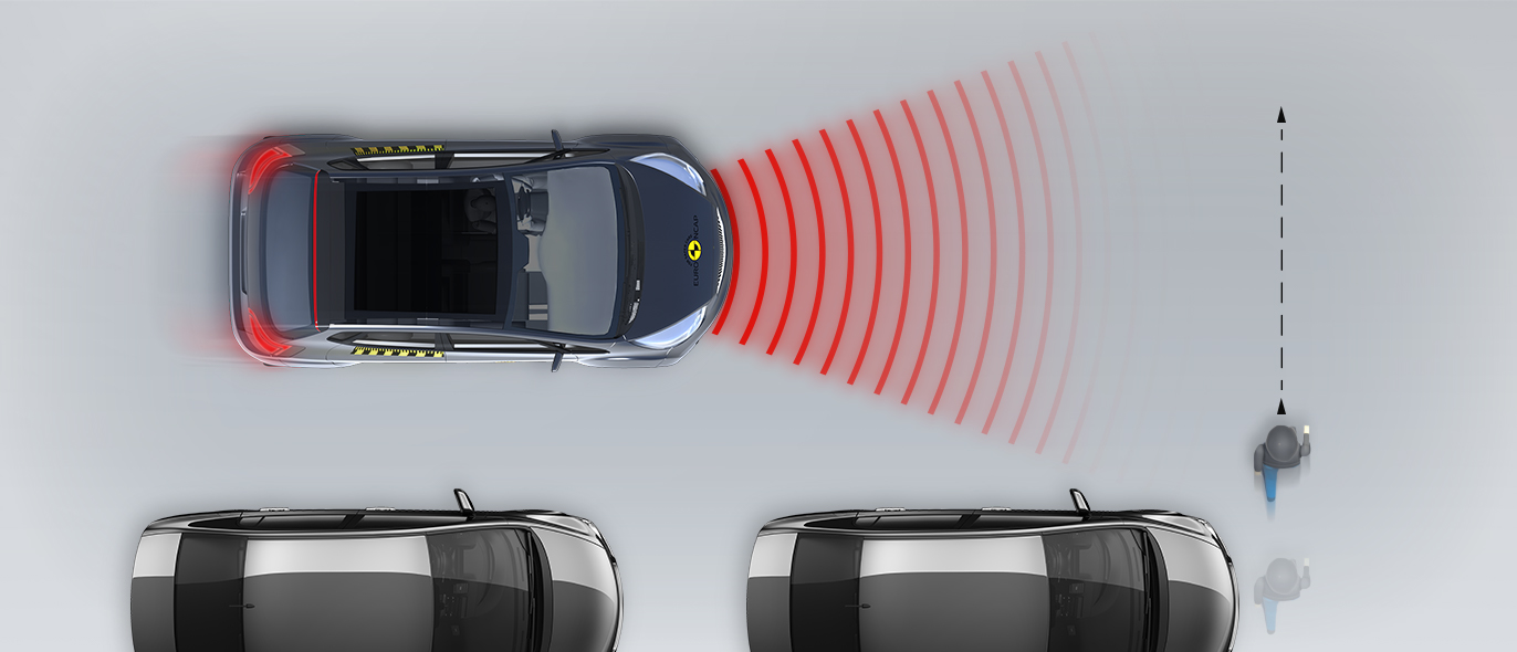 Child running from behind parked vehicles